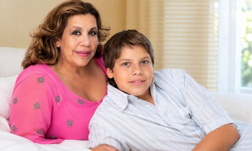 Mildred Patricia Baena sitting with her son Joseph Baena in a warm indoor setting, sharing a relaxed family moment.